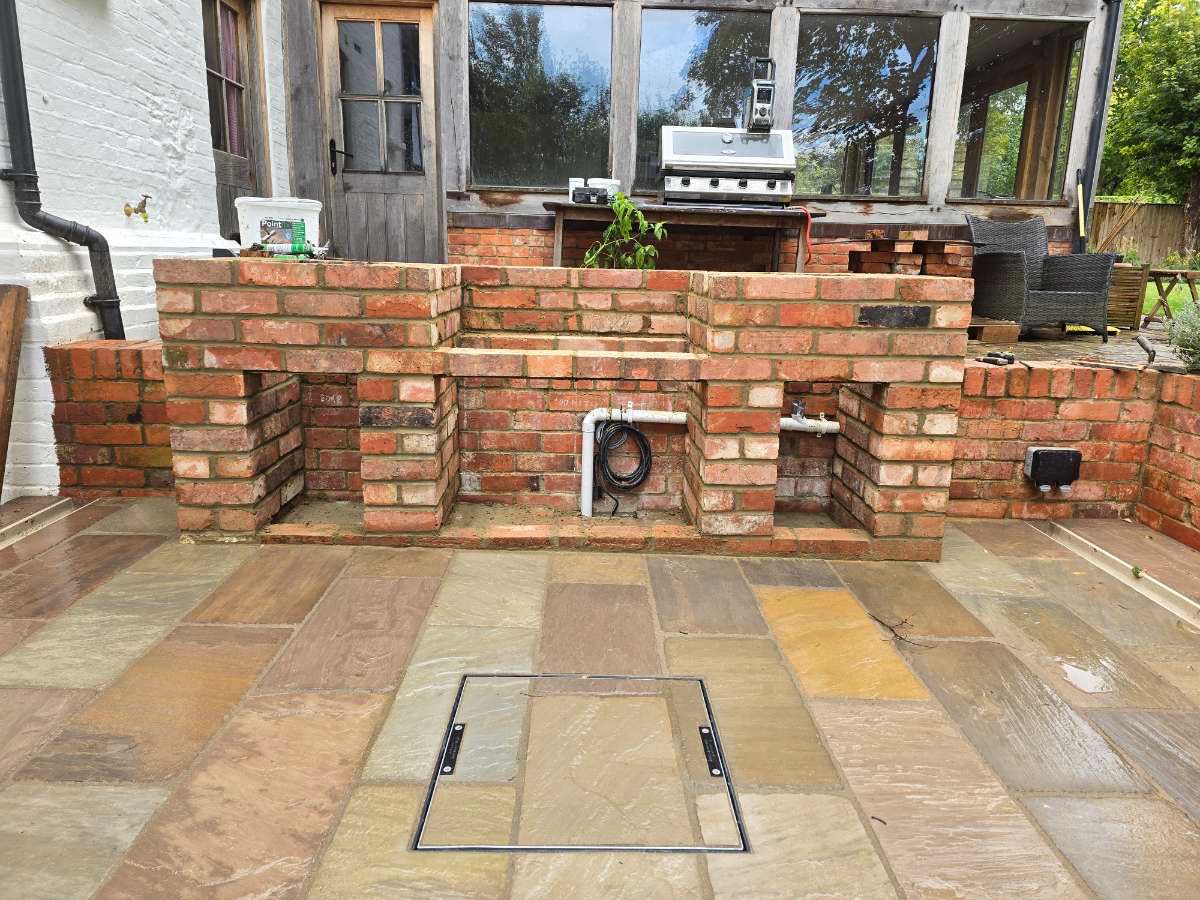 Decorative brick feature wall on a patio